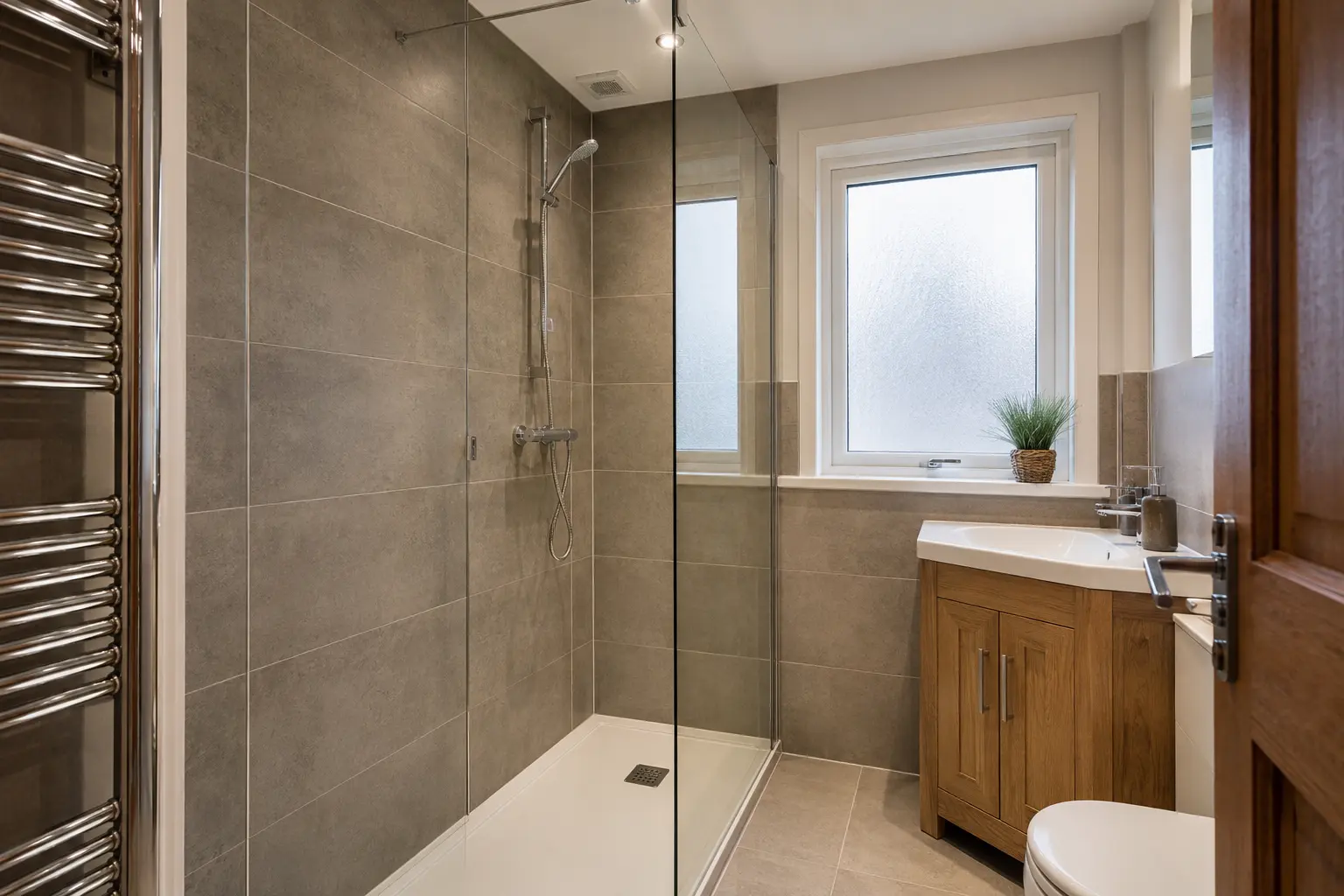 Walk-in shower bathroom with warm grey tiles
